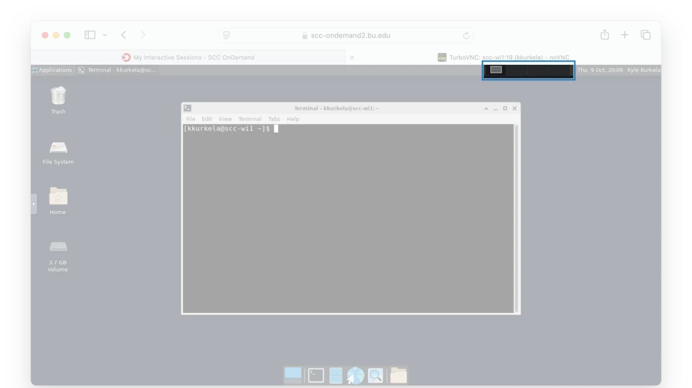 The desktop with the workspace switcher, a row of small boxes near the right end of the top bar, highlighted.